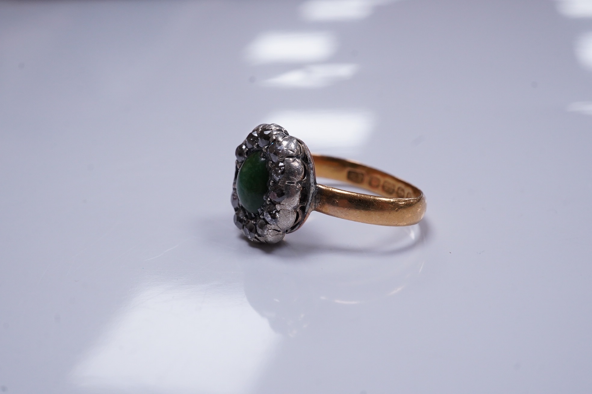 An Edwardian 22ct gold ring shank, with earlier? silver, gold, diamond and turquoise cluster set ring head(diamond missing), size J/K, gross weight 4.6 grams. Condition - poor